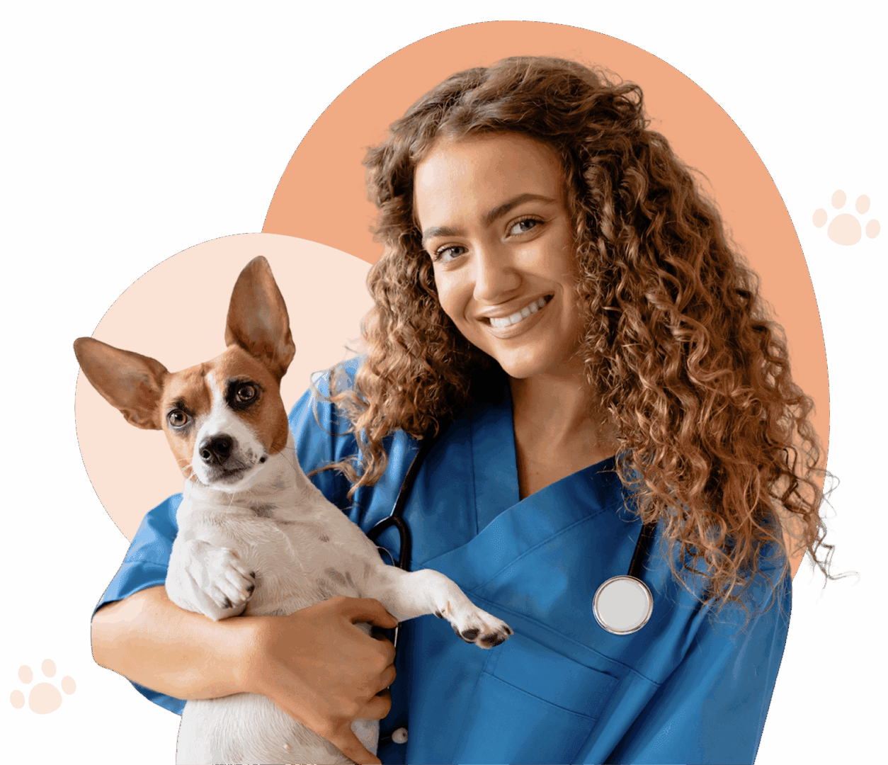 Veterinarian smiling with dog in arms.